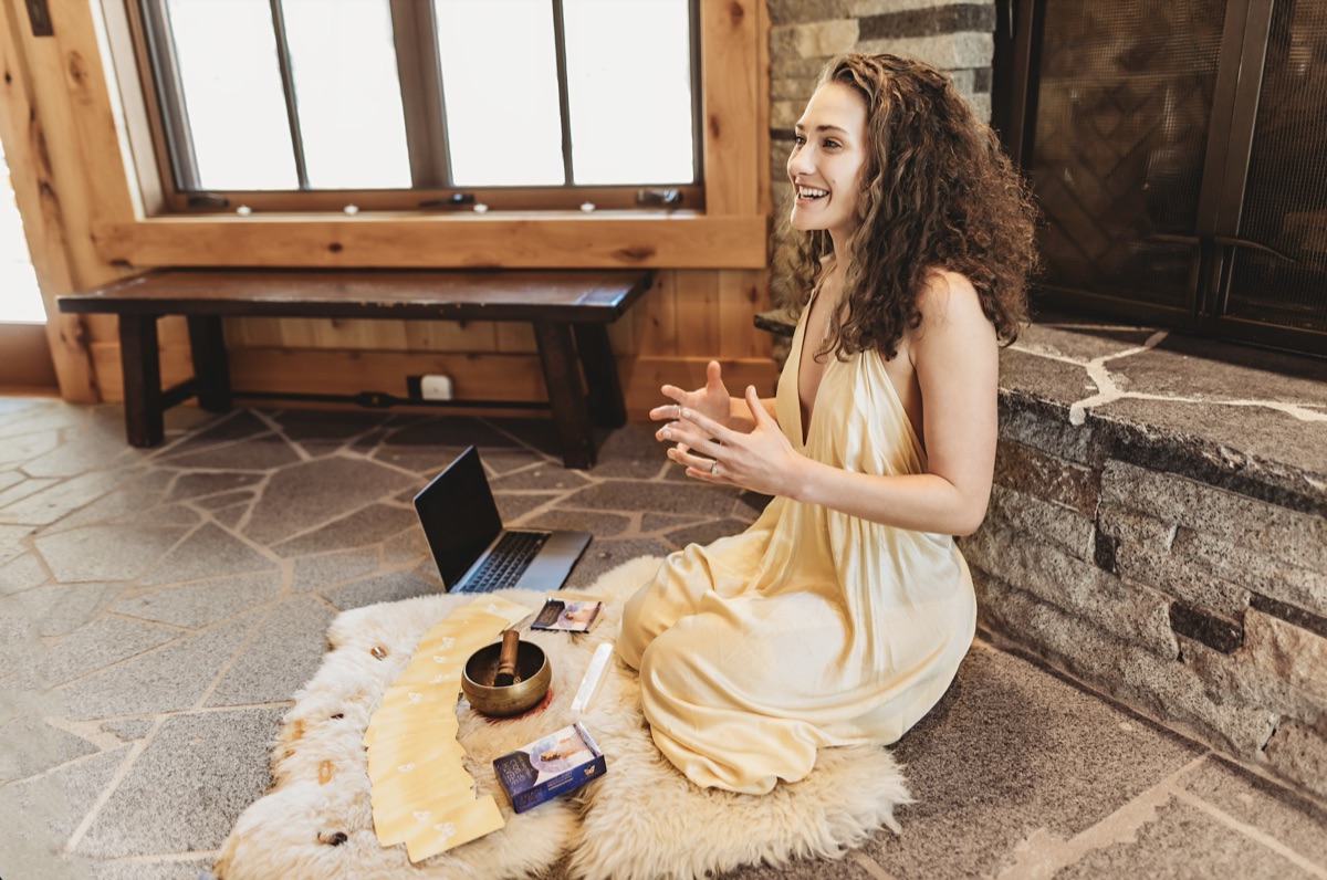 Wide view of an online Breath of Gold session being led from the retreat house living area